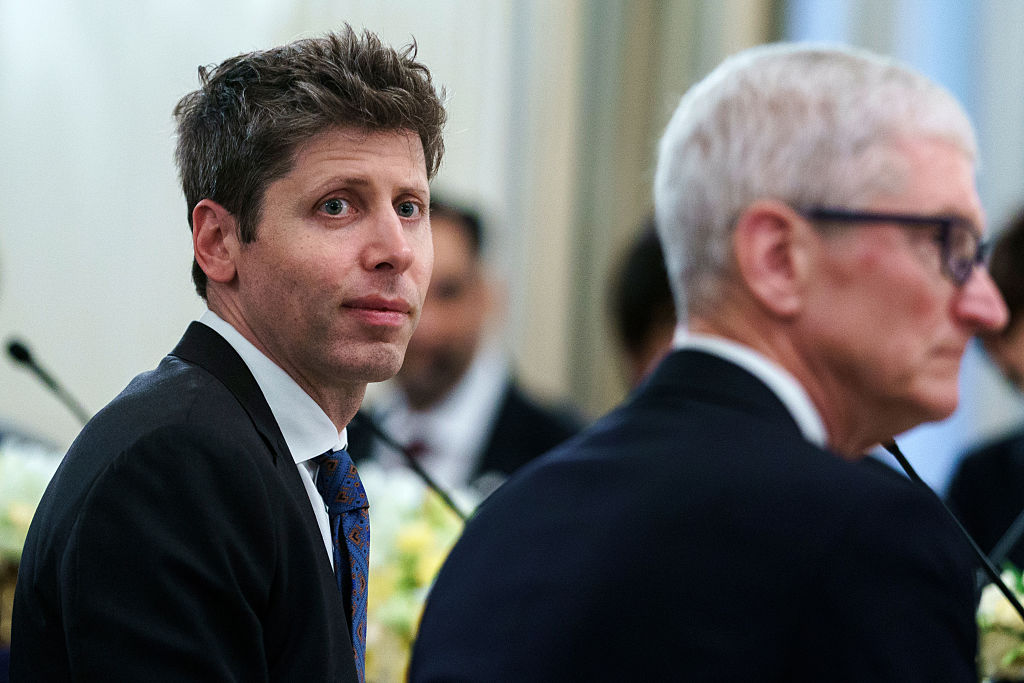 Sam Altman and Tim Cook at a dinner event, amid Apple's trade-secret lawsuit against OpenAI